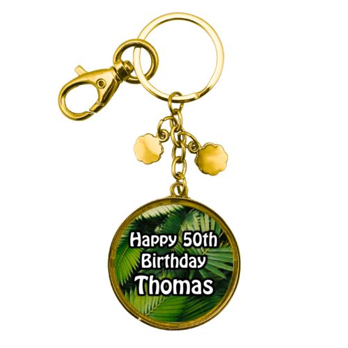 Personalized metal keychain personalized with plants fern pattern and the saying "Happy 50th Birthday Thomas"