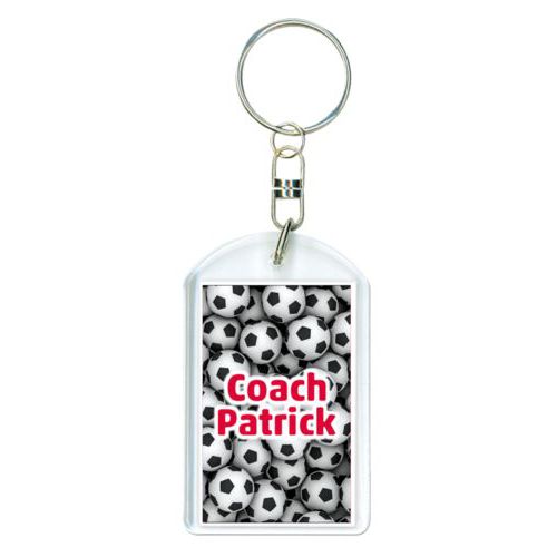 Personalized plastic keychain personalized with soccer balls pattern and the saying "Coach Patrick"