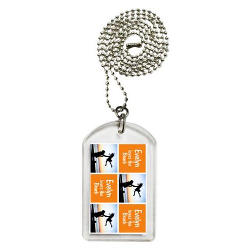 Personalized dog tag personalized with a photo and the saying "Evelyn loves the Beach" in juicy orange and white
