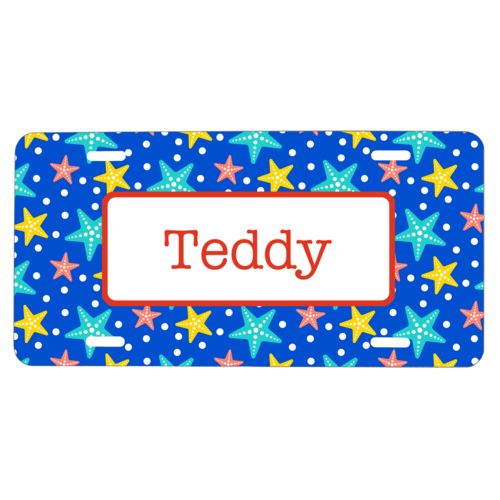 Custom car tag personalized with starfish pattern and name in strong red