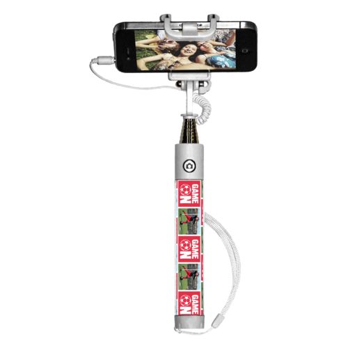 Personalized selfie stick personalized with a photo and the saying "Game On" in cherry red and white