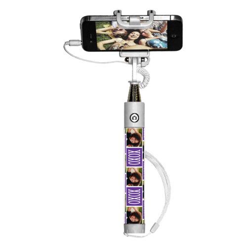 Personalized selfie stick personalized with a photo and the saying "xoxo" in purple and white