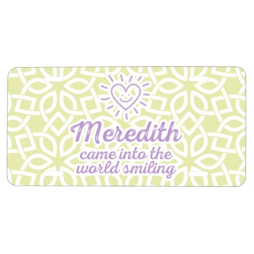 Custom car plate personalized with lattice pattern and the sayings "Meredith came into the world smiling" and "Smiling Heart"