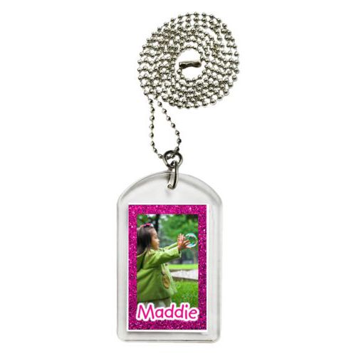Personalized dog tag personalized with pink glitter pattern and photo and the saying "Maddie"