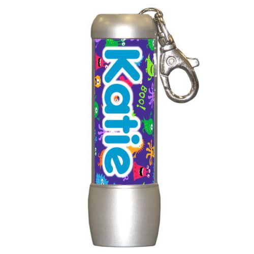 Personalized flashlight personalized with monsters pattern and the saying "Katie"