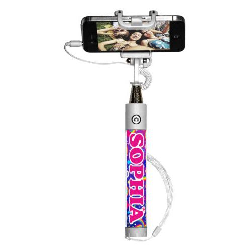 Personalized selfie stick personalized with rainbows pattern and the saying "SOPHIA"