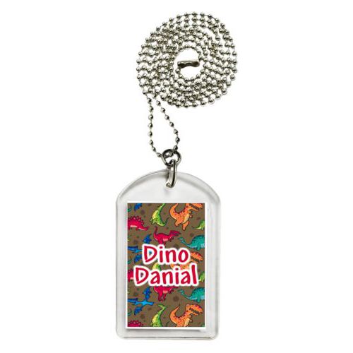 Personalized dog tag personalized with dinosaurs pattern and the saying "Dino Danial"