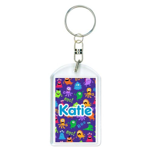 Personalized plastic keychain personalized with monsters pattern and the saying "Katie"
