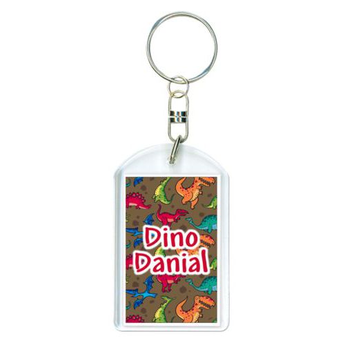 Personalized plastic keychain personalized with dinosaurs pattern and the saying "Dino Danial"