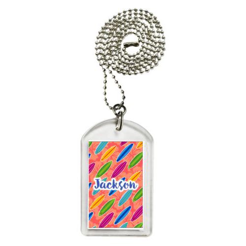 Personalized dog tag personalized with boards pattern and the saying "Jackson"