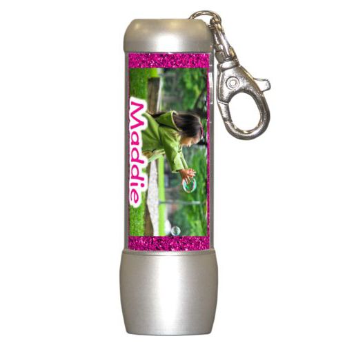 Personalized flashlight personalized with pink glitter pattern and photo and the saying "Maddie"