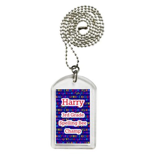 Personalized dog tag personalized with alphabet pattern and the saying "Harry 3rd Grade Spelling Bee Champ"