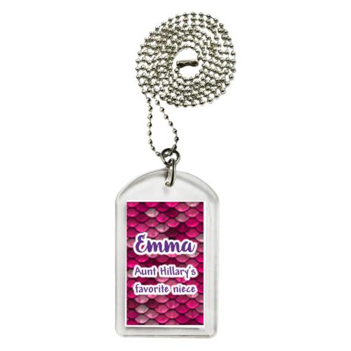 Personalized dog tag personalized with pink mermaid pattern and the saying "Emma Aunt Hillary's favorite niece"