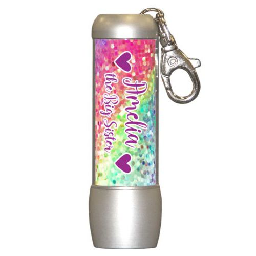 Personalized flashlight personalized with glitter pattern and the sayings "Amelia the Big Sister" and "Heart" and "Heart"