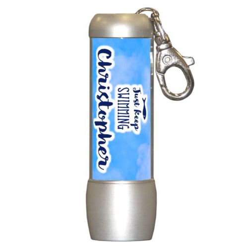 Personalized flashlight personalized with light blue cloud pattern and the sayings "Just Keep Swimming" and "Christopher"