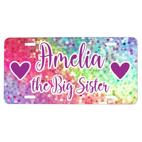 Custom license plate personalized with glitter pattern and the sayings "Amelia the Big Sister" and "Heart" and "Heart"