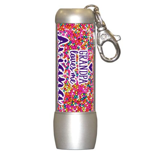 Personalized flashlight personalized with sweets sprinkle pattern and the sayings "Grandpa loves me" and "Aviana"