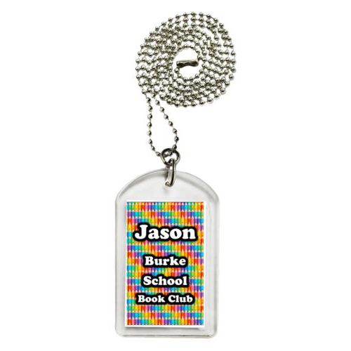 Personalized dog tag personalized with colored pencils pattern and the saying "Jason Burke School Book Club"