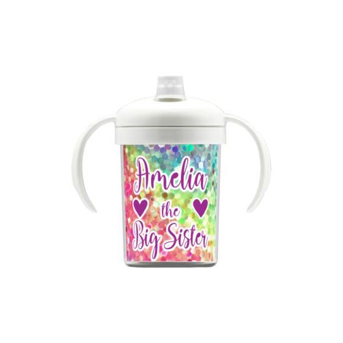 Personalized sippycup personalized with glitter pattern and the sayings "Amelia the Big Sister" and "Heart" and "Heart"