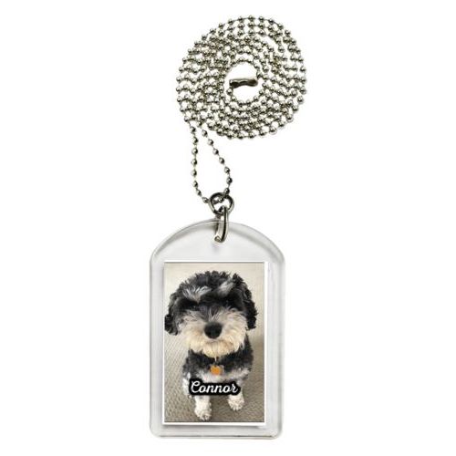 Personalized dog tag personalized with photo and the saying "Connor"