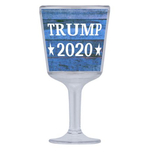 Plastic wine glass personalized with "Trump 2020" on blue wood grain design