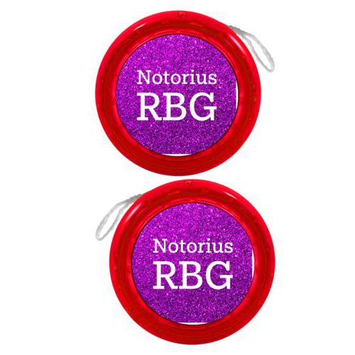 Personalized yoyo personalized with fuchsia glitter pattern and the saying "Notorius RBG"