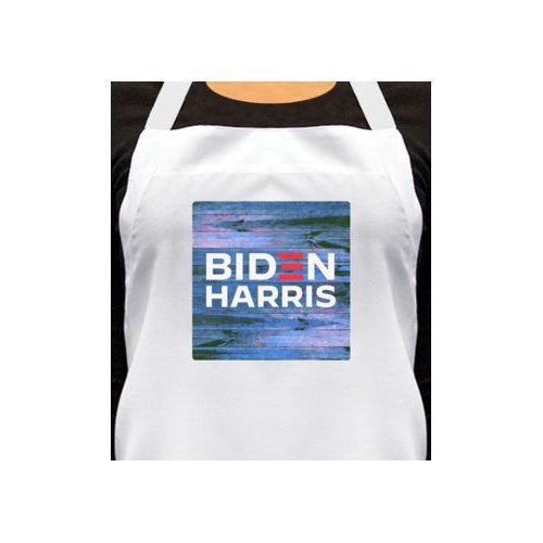 Custom apron personalized with "Biden Harris" logo on blue wood design