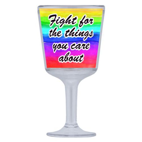Plastic wine glass personalized with "Fight for the things you care about" on rainbow design