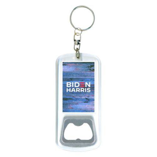Bottle opener with key ring personalized with "Biden Harris" logo on blue wood design