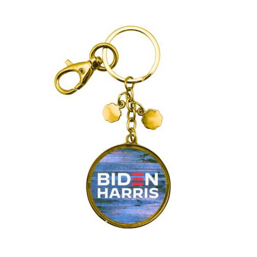 Custom keychain personalized with "Biden Harris" logo on blue wood design