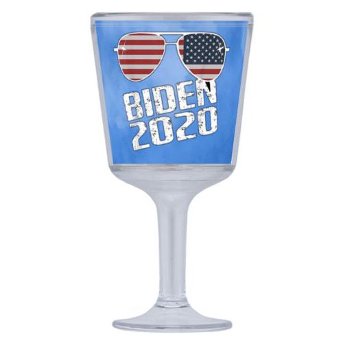 Plastic wine glass personalized with "Biden 2020" sunglasses on blue cloud design